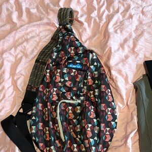 Kavu Tri-Color Geometric Rope Sling Bag in Black, Burgundy, Pumpkin, Teal